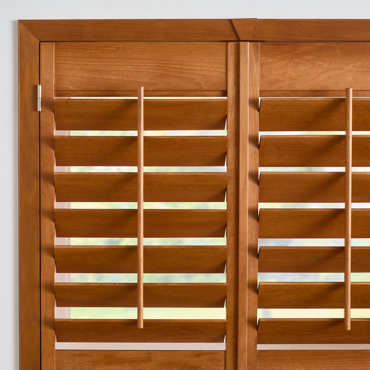 Color: Golden Oak; Frame: Z Overlap; Slats: 3.5 Inch Louver; Split: Divided in the Middle; Panels: Two Panel Split