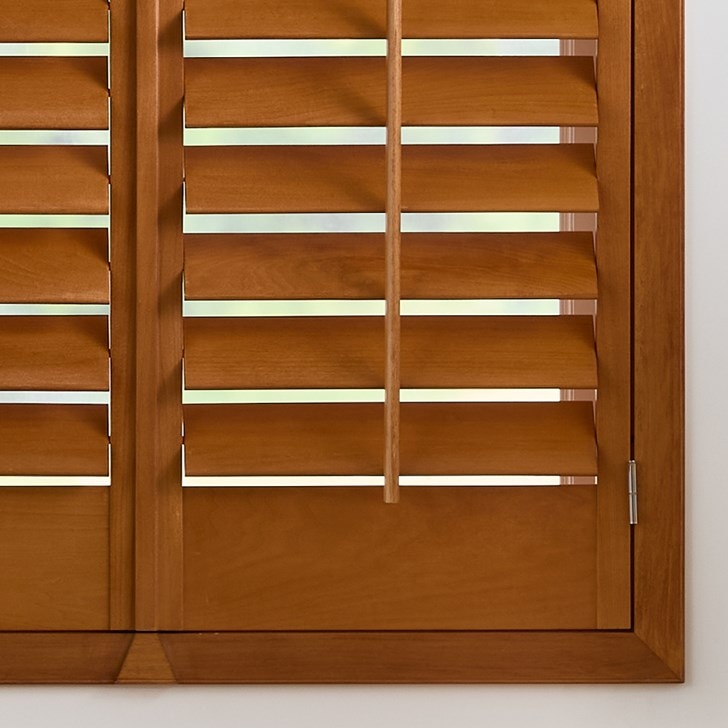 Color: Golden Oak; Frame: Z Overlap; Slats: 3.5 Inch Louver; Split: Divided in the Middle; Panels: Two Panel Split